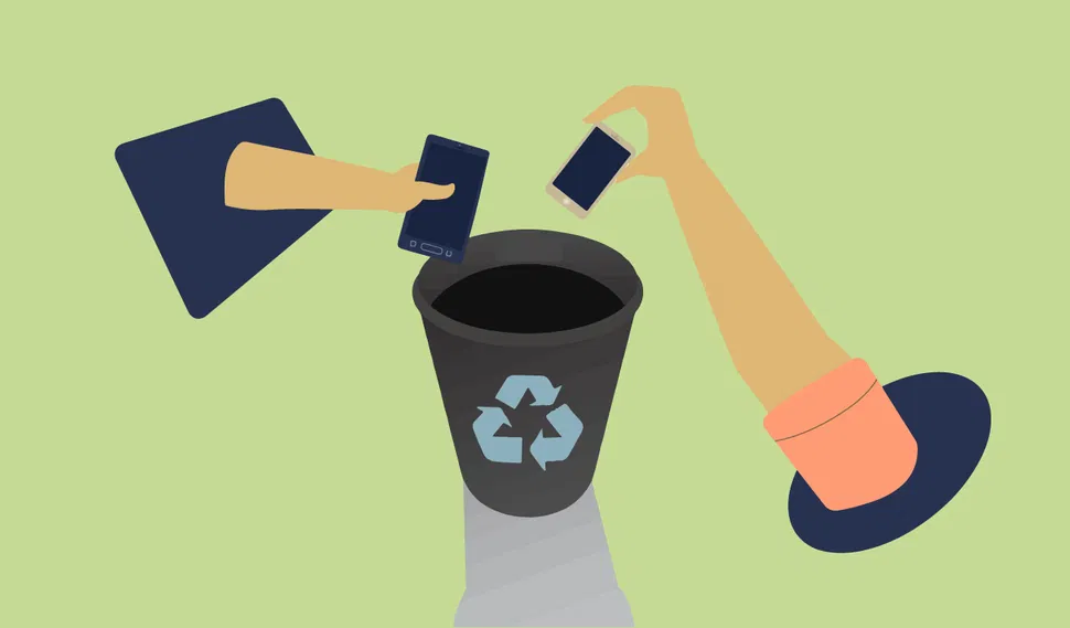 Front view of two hands dropping smartphones into a recycling bin with a recycling symbol, light green background.