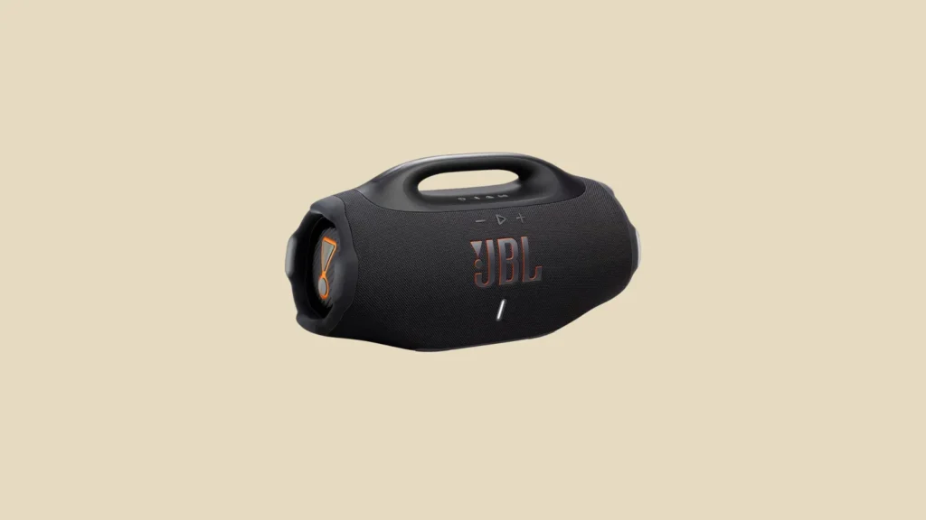 Front view of a black JBL portable Bluetooth speaker with top control buttons and handle, shown on a plain beige background.