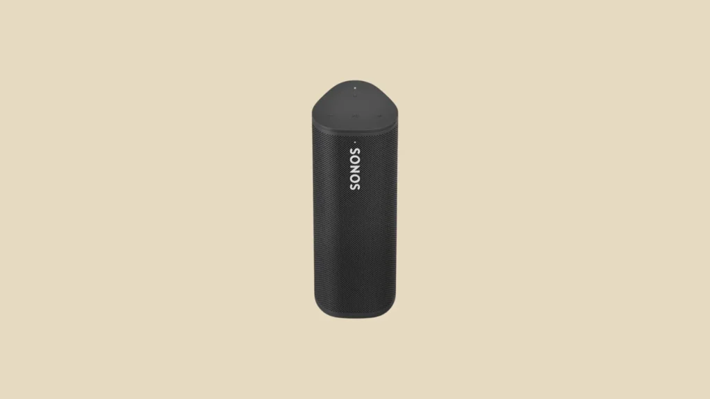 Front view of a black Sonos portable Bluetooth speaker upright on a beige background, "SONOS" logo vertically displayed.