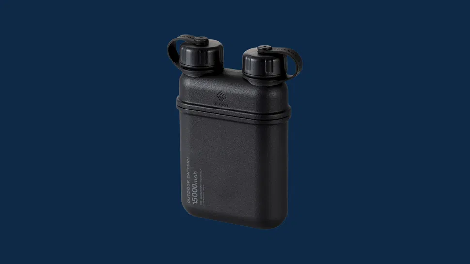 Front view of black rectangular power bank, two capped ports on top, "CORDURA BATTERY 10000 mAh" text on side, dark blue background.