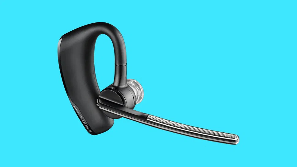 Side view of a black Bluetooth earpiece with an extended mic boom, displayed on a solid light blue background.