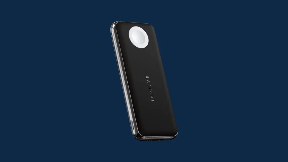 Black Satechi portable wireless charger angled view, circular charging pad on top, set against a solid dark blue background.