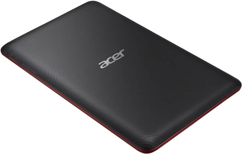 Closed black Acer laptop with red trim, textured lid, and centered Acer logo, viewed from an angled top-down perspective.