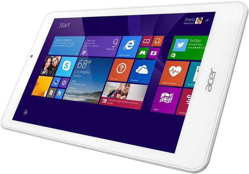 Front view of a white Acer tablet showing the Windows 8 start screen with app tiles on a purple background.