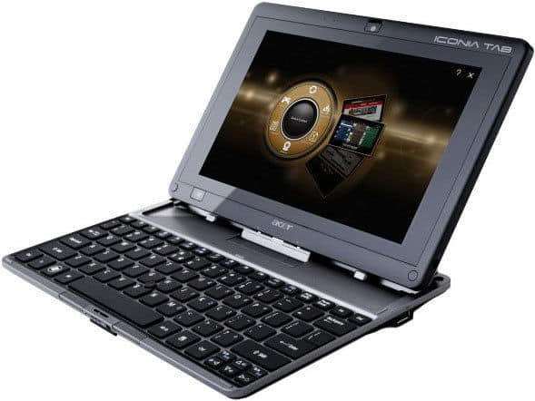 Front view of a black Acer ICONIA TAB with detachable keyboard, open and showing a circular menu on the display.
