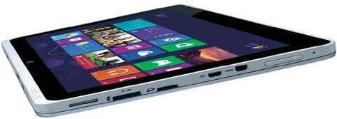 Tablet computer shown from the side, highlighting slim profile and edge ports; black screen displays colorful app tile grid.