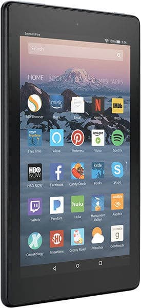 Amazon Fire tablet front view showing home screen with app icons and a snow-covered mountain wallpaper.