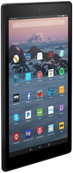 Black tablet, angled front view, displays Netflix, Spotify, Facebook, and Pinterest icons over a mountain wallpaper. Brand/model unspecified.
