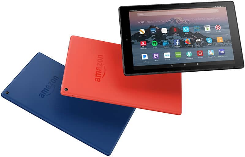 Amazon Fire tablets shown: one front view displaying apps, two rear views in blue and red with embossed Amazon logos.