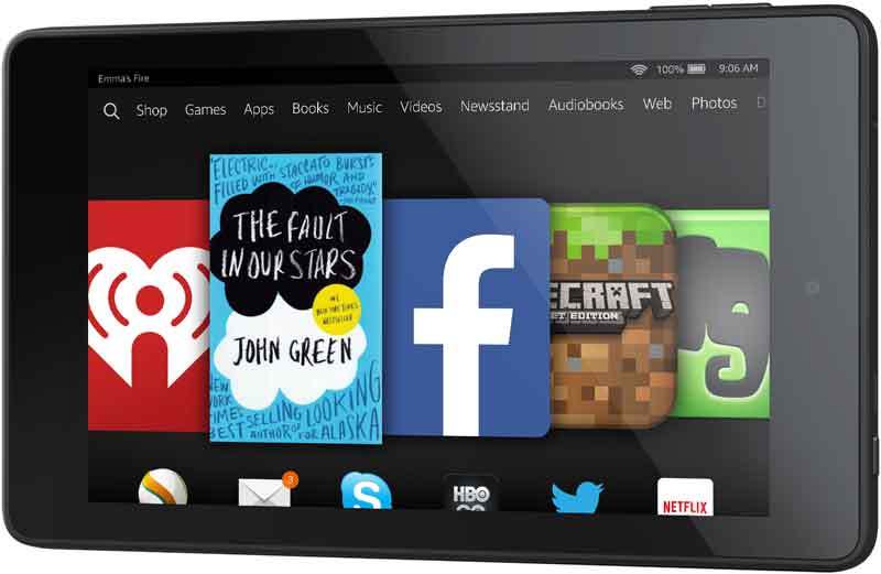Amazon Fire tablet front view showing home screen with iHeartRadio, Facebook, Minecraft apps on a white background.