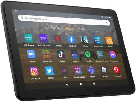 Amazon Fire tablet front view showing home screen with Silk, Netflix, Facebook, Kindle, TikTok apps and top search bar visible.