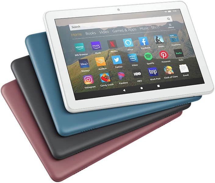 Front view of a white Amazon Fire tablet on top of three others with blue, black, and maroon backs, showing app icons.