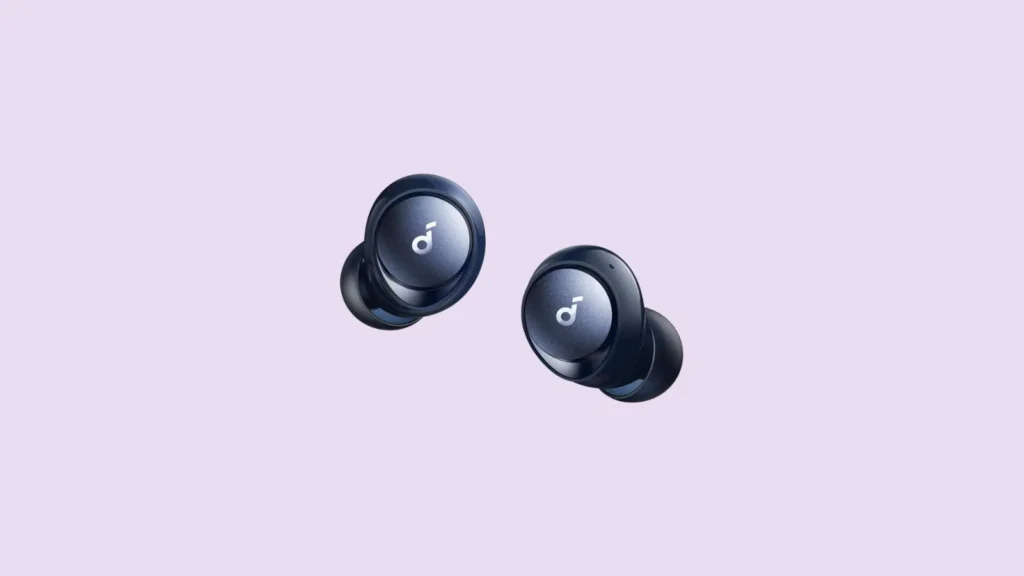 Front view of black wireless earbuds with circular design and white logos, shown on a light purple background.