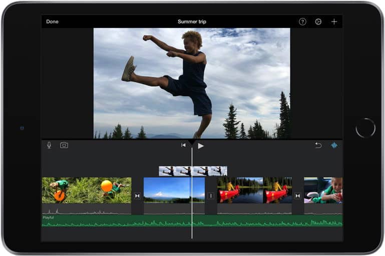 Front view of a tablet, likely iPad, showing glitched video editing software with visible timeline thumbnails and editing tools.