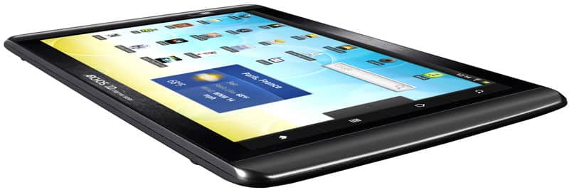 Black tablet with rounded edges and black frame, front screen showing app icons and widgets, viewed from lower side angle.