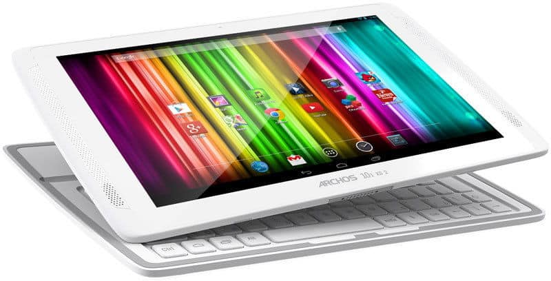 Archos tablet (white) front angled view on white keyboard dock, display showing colorful app icons.