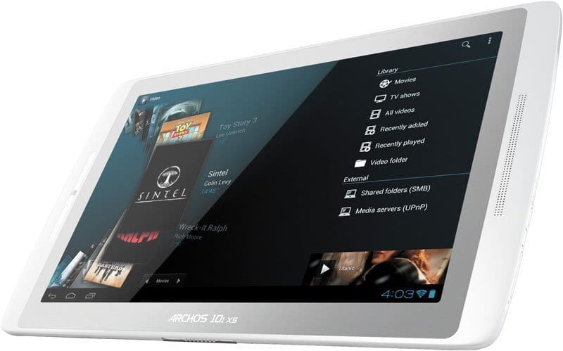 Front view of white Archos 101 XS tablet showing media library with videos, movies, TV menu options; screen time reads 4:03.