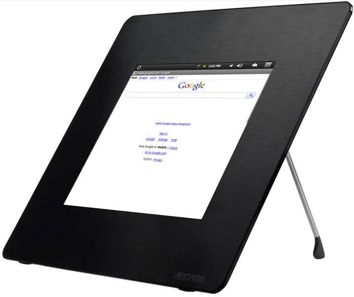 Front angled view of a black digital photo frame displaying Google Search, supported by a rear metal stand. Brand/model unknown.