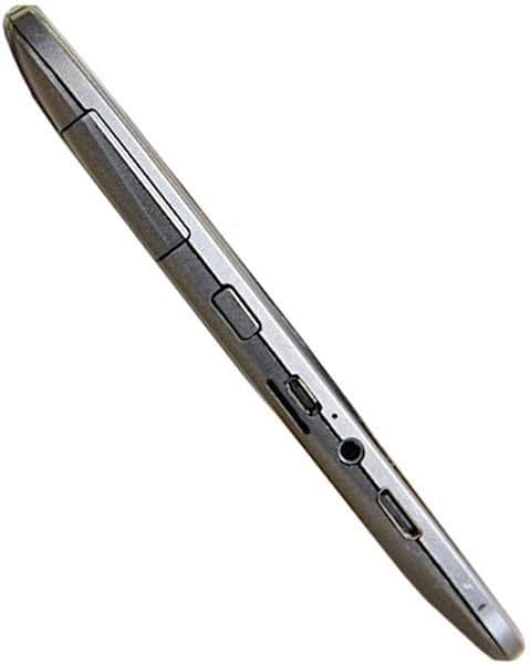Side view of slim, silver tablet showing buttons, headphone jack, and charging port on white background; brand/model unspecified.