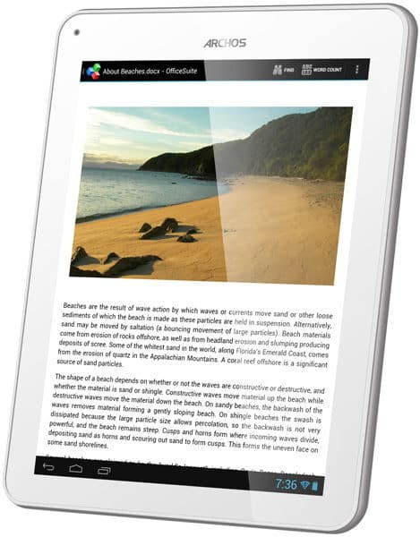 Front view of white Archos tablet showing a beach article, app icons at bottom, and time 7:36 on the display.