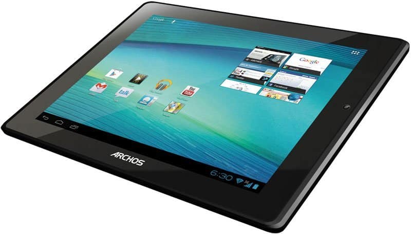 Archos tablet, front angled view, black bezel, home screen with app icons and widgets on blue background, time 6:30.