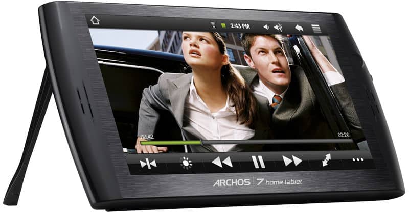 Front view of black Archos 7 Home Tablet with kickstand extended, screen paused on video; controls and status bar visible.