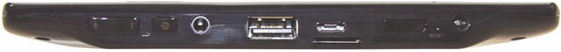 Side view of tablet showing USB port, headphone jack, charging port, and connectors; brand and model not specified.