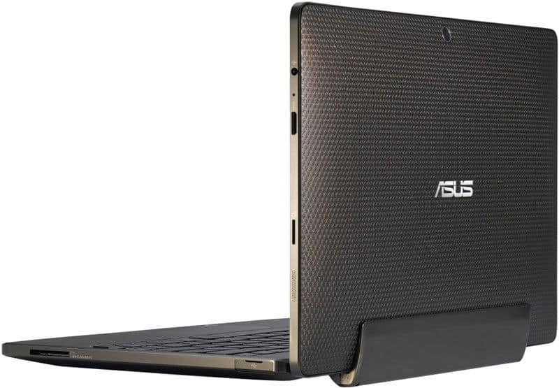 Asus laptop, back left view, partially open with carbon-fiber texture and edge ports, emulates tablet-like sleekness.