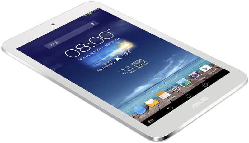 White Asus tablet, angled front view, screen displaying weather, time, app icons, and dock by ocean background.