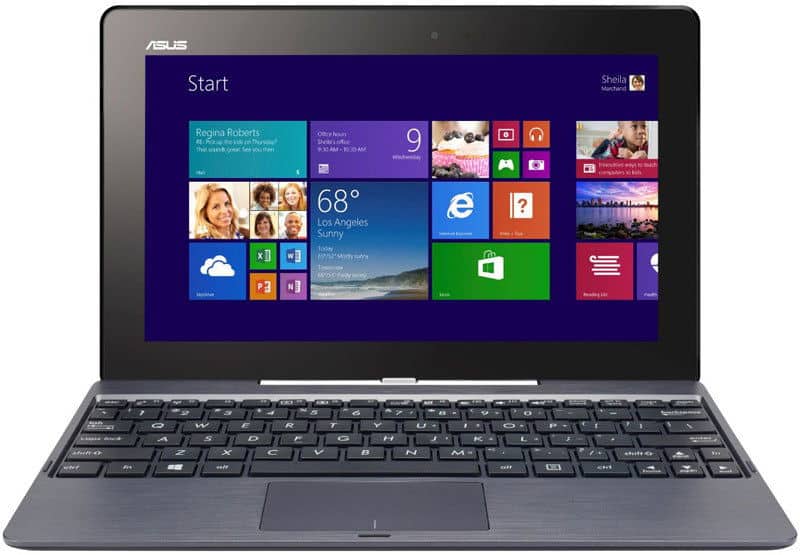 Front view of ASUS Transformer laptop-tablet hybrid showing Windows 8 Start menu above a black keyboard.