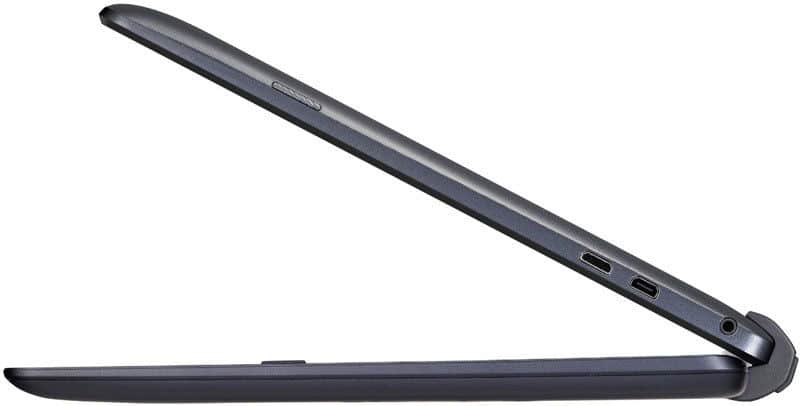 Side view of a dark gray slim tablet-style laptop, likely Microsoft Surface Pro, showing two USB-C ports and headphone jack.