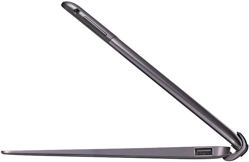 Side view of a thin, silver tablet partially open, showing USB port and headphone jack; brand/model unspecified.