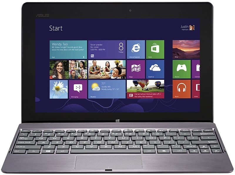 Microsoft Surface Pro shown from the front with keyboard attached, displaying Windows 8 Start screen; white background.