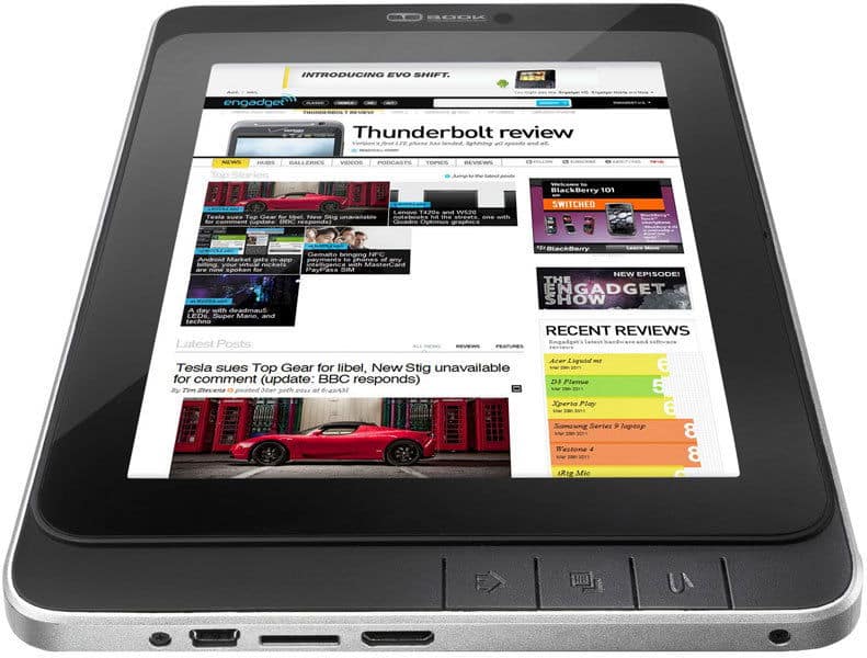 Front view of a black tablet, possibly iPad, showing a tech news site on screen with bottom edge buttons and ports visible.