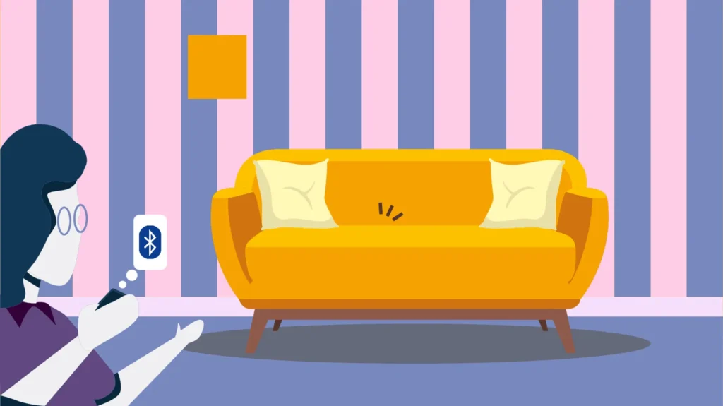 Front view: person with glasses holding bluetooth tracker on device, yellow sofa and striped wallpaper in the background.