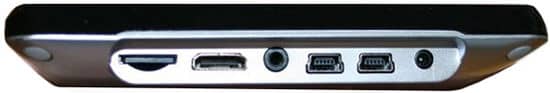 Side view of tablet showing memory card slot, HDMI port, audio jack, two FireWire ports, and power input. Brand/model not shown.