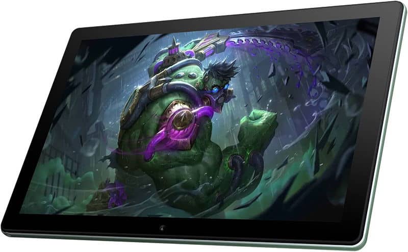 Front view of a tablet, likely Apple iPad, displaying a digital illustration with a green armored creature in an industrial setting.