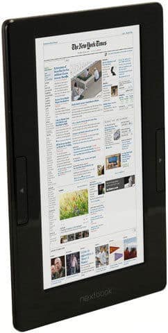 Front view of a black Apple iPad showing The New York Times site, glossy bezel, and side buttons in portrait orientation.