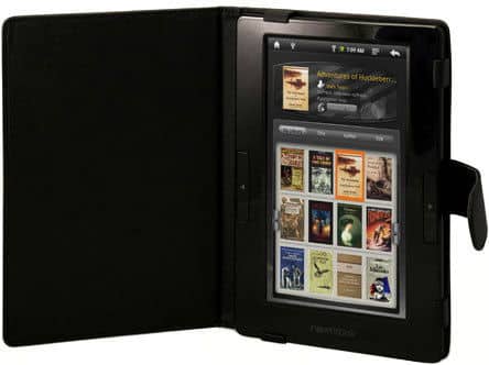 Front view of a black Kindle Scribe in a folio case, color screen on with digital bookshelf and book covers visible.