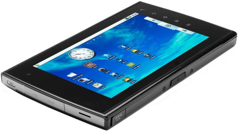 Black tablet, likely Samsung Galaxy Tab, front left angle; blue home screen with clock and app icons visible.