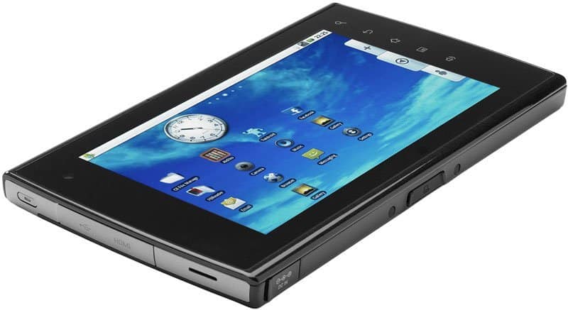Angled front-side view of a black tablet showing the home screen; edge buttons and ports are clearly visible.
