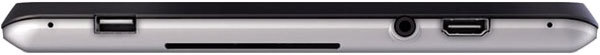 Side close-up of black metallic tablet edge with power button, audio jack, HDMI port, and possible memory card slot. Brand/model not shown.