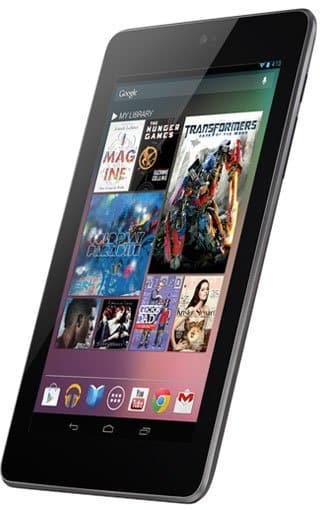 Google Nexus 7 tablet in black, angled front view showing home screen with app icons and media like books, magazines, and movies.