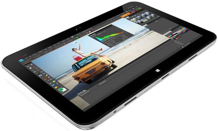 Front view of a black tablet, likely an iPad Pro, showing photo-editing software with editing tools and color panels on screen.