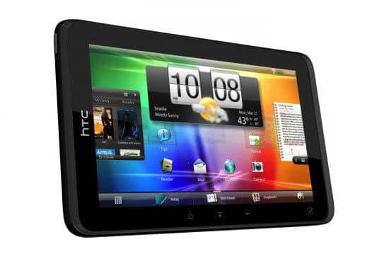 Front view of a black HTC tablet showing colorful home screen with widgets and app icons, set against a plain white background.