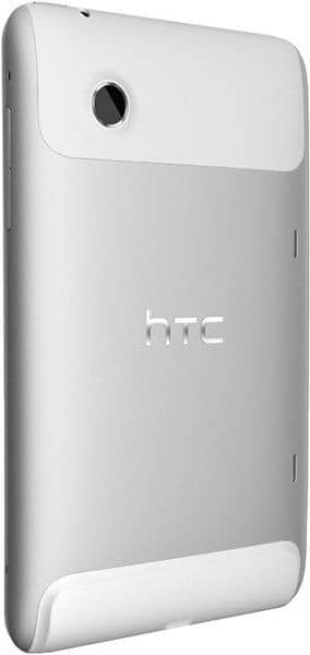 HTC tablet rear angled view showing silver and white finish, top left rear camera, and centered HTC logo. Model not specified.