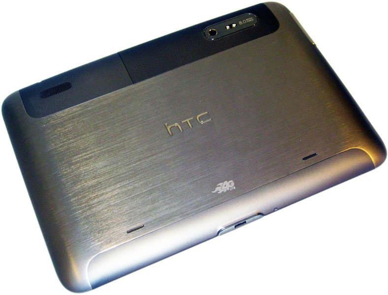HTC tablet rear view showing brushed metal finish, camera, flash, speaker grill, and HTC 4G branding.