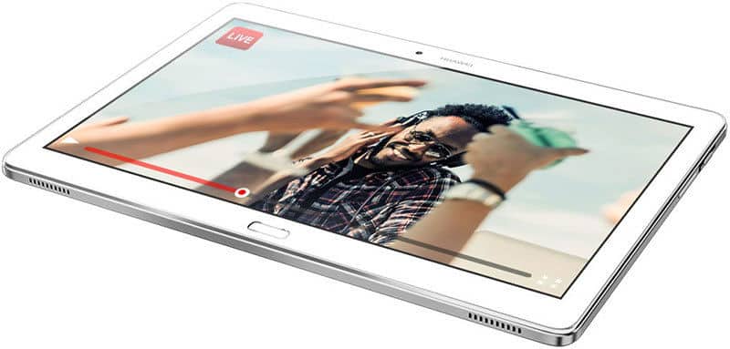 Front view of a white tablet lying flat, screen showing a streaming video with a man in headphones and visible progress bar.