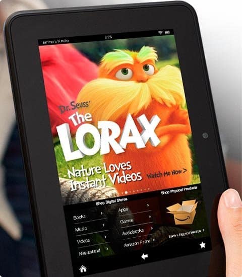 Front view of black tablet, likely an iPad, held in hand showing "The Lorax" movie screen with streaming menu options.