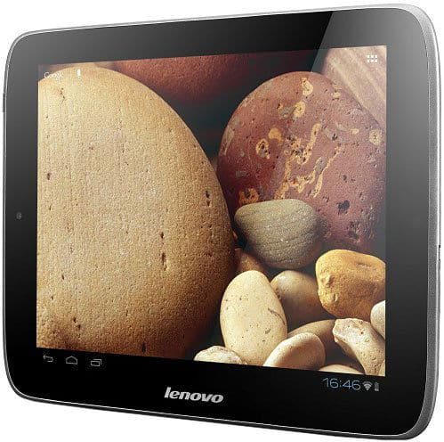 Lenovo tablet (model unspecified), angled front view, screen on with multicolored stones wallpaper, 16:46 time, app icons visible.